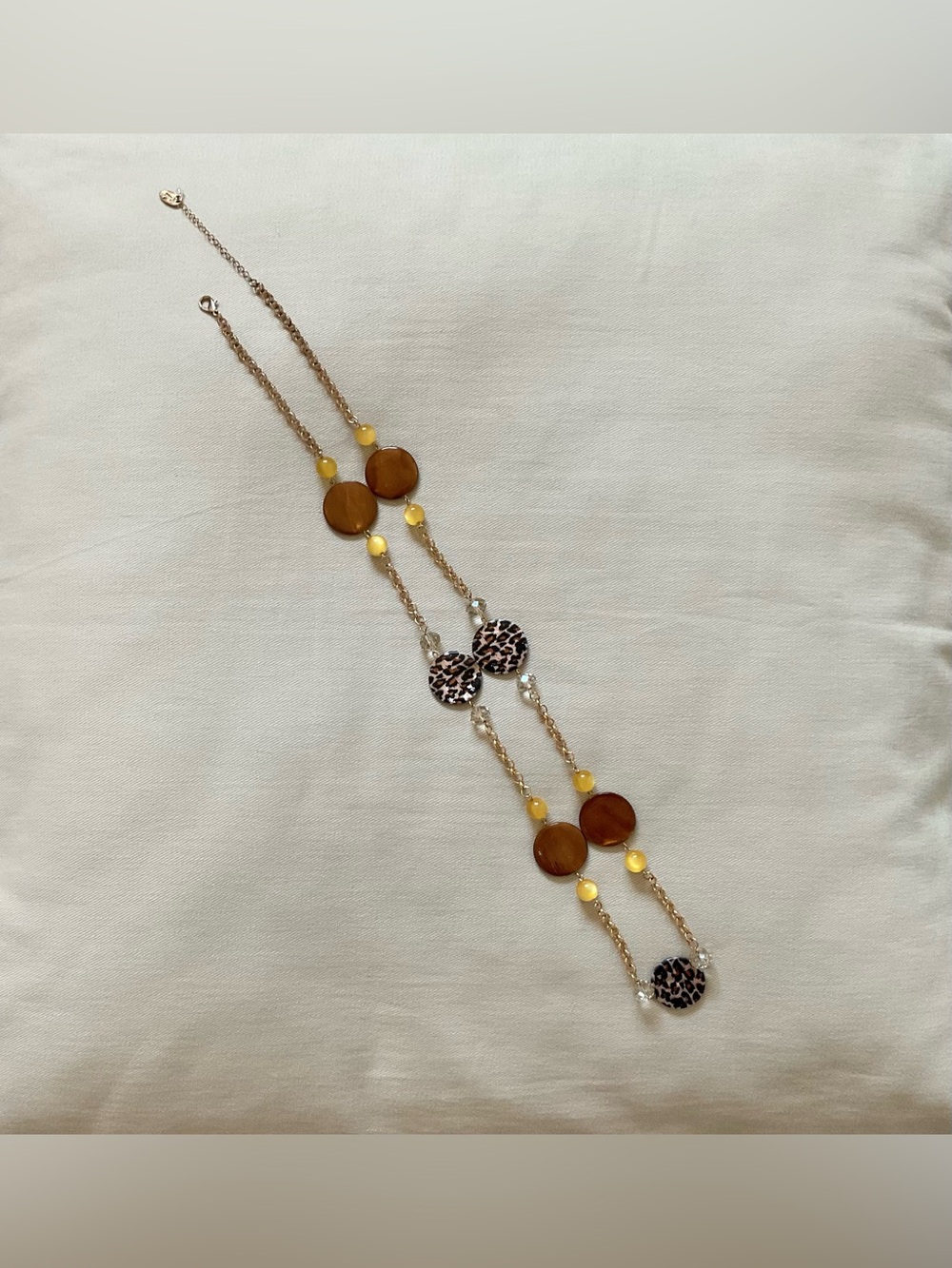 Long Statement Necklace with Leopard Print Discs and Gold Tone Chain